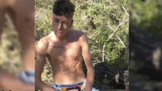 Skinny twink Craig Kennedy strips down and shows his big dick in a public forest