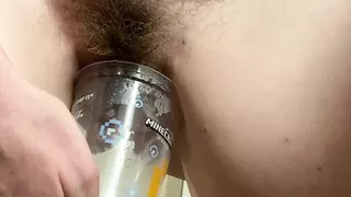 Desperate MILF rushes back to hotel to do HUGE piss in a plastic cup! After filling it once, she strips naked to finish it off