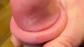 Big shiny cockhead with pink foreskin like a nipple to suck on