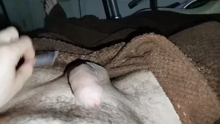 Close-up handjob in a thin condom with cumming in it.