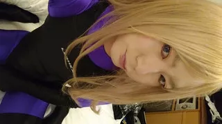 A blonde cross-dressing boy masturbated excitedly wearing purple full-body tights and a competitive swimsuit