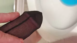 BWC pissing and playing through his cock stocking