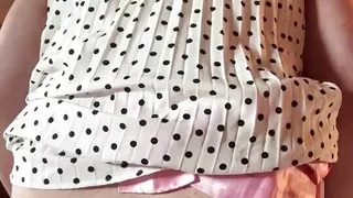 Dressed in a pleated weighted dress with a mouth spreader to take a dildo