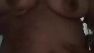 Squeezing the breasts after showering