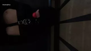 Gagged and Hooded Slave struggles in Straitjacket While In Cage