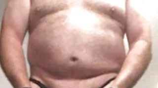 Brandon Hegsted wearing thigh highs, panties and handcuffs