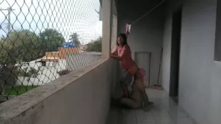 My wife teasing me on balcony