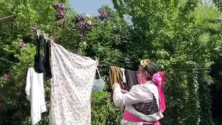 In gardening attire for a day and to hang the laundry.