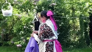 In gardening outfit to hang the laundry outside