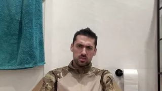 Military guy two hands jerks his meat