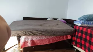 An amateur mom tries on clothes and cuts them. An amateur woman dances naked in the house.