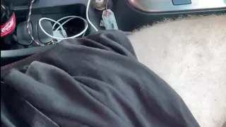 Young cute taxi uber grab driver catches passenger jerking while driving and gives helping hand.