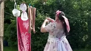 In outfit with a little babydoll dress to hang the laundry.