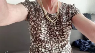 Schnucka pampers herself in a satin dress