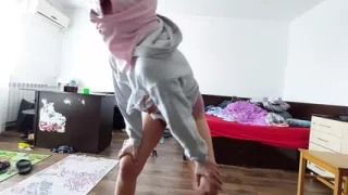 An amateur woman dances naked in the house.