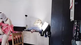 The sexy wife is having fun testing clothes and cuts them. The brunette dances naked around the house.