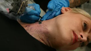 Alira Astro Gets a Tribal Neck Tattoo with Sascha's Name - AltErotic