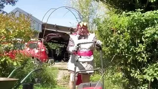 In outfit with a genital cover to mow the lawn.