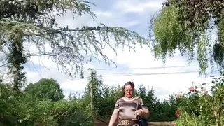 In an outfit with a ruffled anthracite dress for an evening.