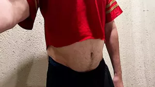 Athlete shows his ball gut and navel
