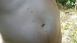 Naked boy walk in the wood