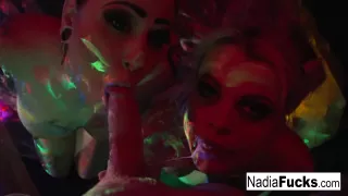 Nadia White : Black-light babes Nadia and Ophelia suck off a colorful cock