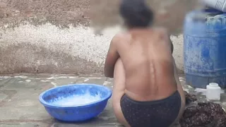 My relative's housewife is taking bath in the open bathroom wearing black underwear at my house