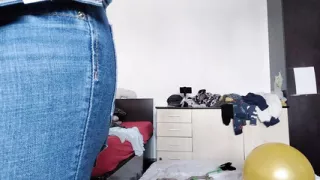 An amateur has fun trying on clothes she has cut. An amateur dances naked in the house.