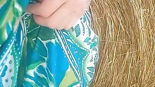 In the countryside: hay bale and red pussy