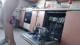 Sexy nude wife preparing food in the kitchen. Hairy brown hair, big ass, big tits.