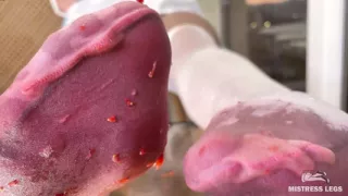 My Nylon Feet Squeezing Strawberry Juice on a Glass Table