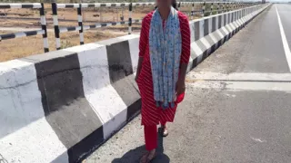 Komal and driver on the highway bridge