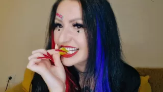 Food fetish. Dominatrix chews gummies. Teeth fetish, chewing fetish