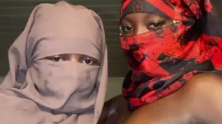 Ebony ladies massaging each other's boobs