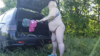 Mother-in-law masturbates her pussy in nature