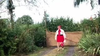 In an outfit with a little red skirt and a new blouse for an evening out.