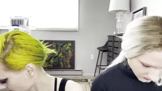 Man and Woman Putting on Mascara and Fake Lashes