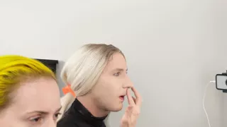 Crossdresser Putting On Foundation