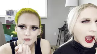 Man and Woman Putting on Lipliner and Lipstick