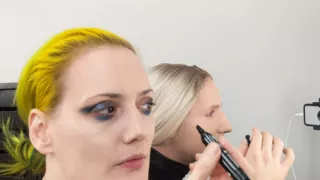 Sissy Bailey Wilde and Woman Putting On Makeup