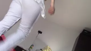 Amateur wife dancing naked at home. Amateur woman has fun trying on clothes and cutting them.