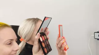 Sissy Bailey Wilde and Woman Putting on Foundation and Eye Shadow