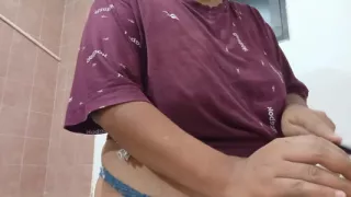 Chubby mother-in-law in the kitchen in underwear