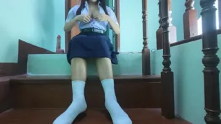High school student fake on the stairs of a Real Thai Solo house