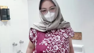 Fountain of a girl in a batik daster dress