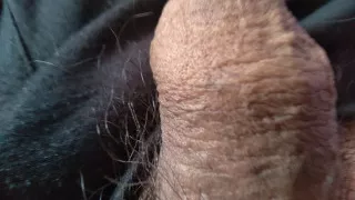 gay man touches his large foreskin for pleasure