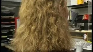 Curly haired blonde gets her hairy pussy fingered