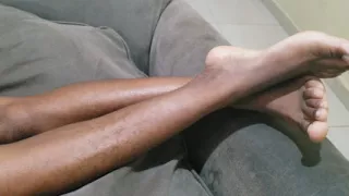 A Woman with Lots of Beautiful Pubic Hair Between Her Legs Lies on Her Sofa Waiting to Be Made Love to Her