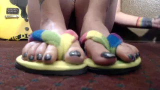 Closeup toe wiggling flip flops nude