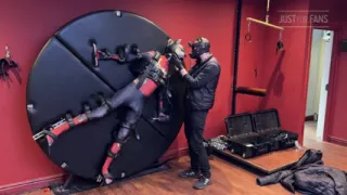 Pup Twink Dressed as Spider-man Strapped to the Bondage Wheel and Milked